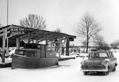  Cold Winter with a car on the iced canal 